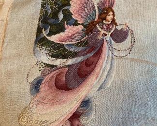 Unframed needlework.