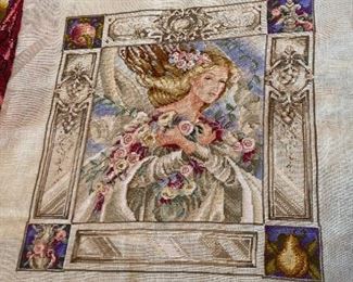 Unframed needlework.