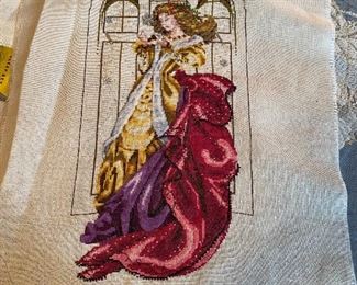 Unframed needlework.