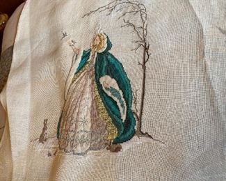 Unframed needlework.