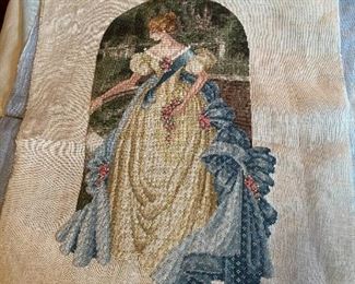 Unframed needlework.