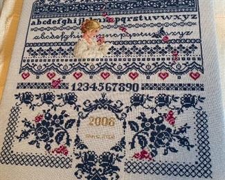 Unframed needlework.