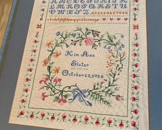 Unframed needlework.