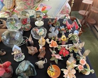 Ceramic, porcelain and snow globe birds.