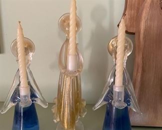 Set of three glass candlestick holders.