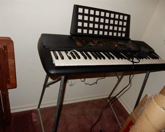 Yamaha keyboard on stand