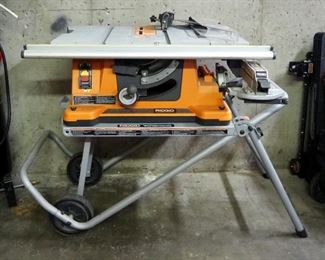 Ridgid Table Saw, Model TS2400-1, Attached To Work-N-Haul Collapsible 2-Wheeled Work Stand