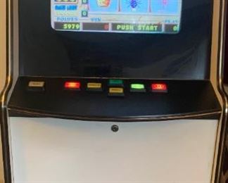 Vintage Arcade Game/Gaming Machine with tokens and keys.