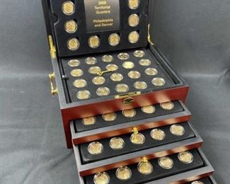 For your consideration is this Gold Plated US Quarters + Territories P,D Box Set.  A truly awesome set to own with 112 quarters total.  Includes P & D of all 50 states + Territories.  Quarters appear to be gold plated BU.  Box includes working key.