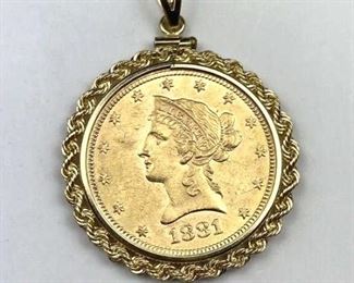 For your consideration is this 1881-S U.S. $10 Gold Liberty in 14K Gold Bezel. Very nice condition coin, doesn't appear to be polished as many jewelry pieces tend to be. Coin can rotate freely which likely means it has not been damaged by the bezel. Coin & Bezel Guaranteed authentic. Bezel marked 14K.