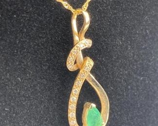 For your consideration is this 14K Gold w/ Emerald & Diamond on 14K Chain.  Marked and tested.  Weighs approx. 2.5 grams.