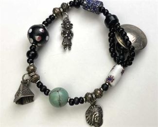For your consideration is this Bead Bracelet w/ Silver Charms & Buffalo Nickel.  Unique Native American themed bracelet featuring an altered buffalo nickel which works well as a unique clasp.  Also includes several Indian themed 925 silver charms.