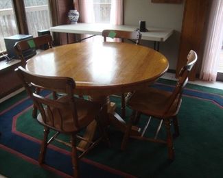 Round oak table and 4 maple chairs