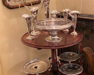 Early 19th Century drop-leaf dumbwaiter.  It closes to 5” wide.  Every piece there is sterling silver!