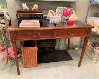 Antique desk with embossed leather top.  Perfect size for a small office.  The wood is gorgeous!