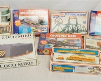1108 LOT OF 8 TRAIN ACCESSORIES BUILDING KITS THREE OF WHICH ARE SEALED IN BOX. 7 ARE LIFE-LIKE & ONE IS MODEL POWER
