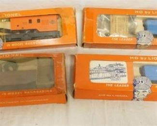1190 LOT OF 4 HO BY LIONEL MODEL TRAINS/ACCESSORIES, NO. 0889 WRECKER CRANE CAR, NO 0357 COP & HOBO CAR (2) & 0900 REMOTE CONTROL TRACK SECTION
