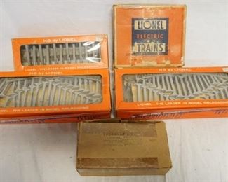 1197 LOT OF LIONEL MODEL TRAIN ACCSESORIES. LOT INCLUDES THREE HO BY LIONEL; 0111 TRESTLE SET & TWO 0110 GRADUATED TRESTLE SETS, SET OF 12 TELEPHONE POLES & NO. 310 BILLBOARD SET. 
