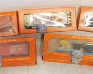 1199 LOT OF 5 HO BY LIONEL MODEL TRAINS, NO. 0333 OPERATING SATELLITE LAUNCHING CAR, 0861, 0850, 0847, & NO. 0847-110 EXPLODING TARGET CAR. 
