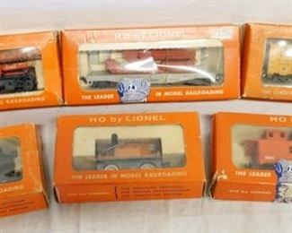 1200 LOT OF 6 HO BY LIONEL MODEL TRAINS, NO. 0605 STEAM SWITCHER W/ HEADLIGHT, 0050, 0300, 0872-50, NO. 0850-110 MISSILE LAUNCHING CAR, & NO. 0841 CABOOSE
