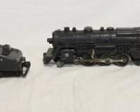 1329	MODEL TRAIN LOT INCLUDES 3 LOCOMOTIVES & ONE LIONEL TENDER. ONE LOCOMOTIVE IS MARKED LIONEL
