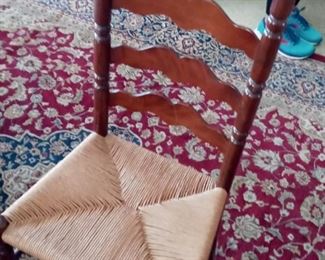 Rustic wood ladder back chair with handwoven rush seating