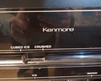 Kenmore refrigerator (close-up of water and ice dispenser)