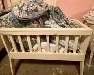 Linens and white cradle 
