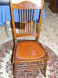 Oak ladies pressed back sewing rocker. Circa 1900.