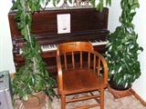 Unusual height Cable Nelson piano. Arch of ivy, yikes!