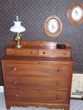 Victorian five drawer dresser with scalloped skirt.