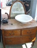 Antique birdseye maple dresser with oval mirror.