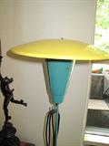 Unique outdoor lamp adjusts to go into the ground.