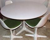 Saarinen design influence dining set by Burke of Texas.