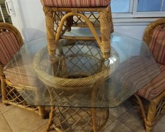 Rattan table and 4 sturdy chairs with hexagon glass top
29" tall x 48" diameter 