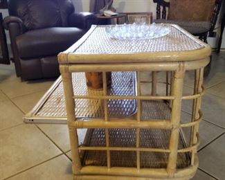Vintage swivel bamboo coffee table with pull out shelf 
26" tall x 30" long x 20" wide 