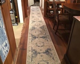 Very long blue and white runner rug