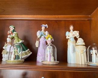 This part of the collection is the large figurine plus the small miniature in a glass dome