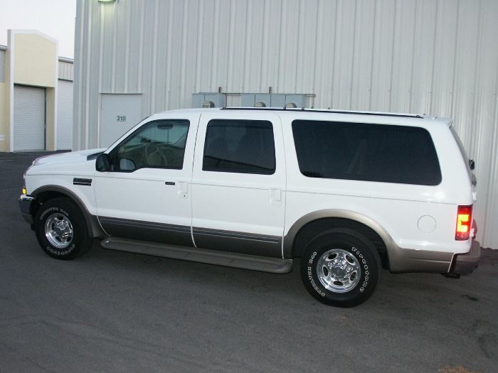 2002 FORD EXCURSION 7.3 DIESEL. White with tan leather interior. Upgrades. One owner. Garage kept. Pristine Condition!
