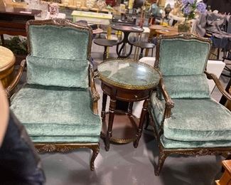 Antique velvet armed conversation chairs with ornate walnut frames. Lamp table with removable jade tray top single drawer and bottom shelf