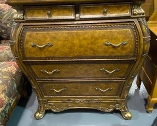 Ornate Bombay Chest/Desk with drop down desk, letter boxes several small stationary drawers in top with light. Lower base has three large drawers. Distressed brown with gold accents  . Detailed scrolled docorative finish 43”w x18” d x42” h