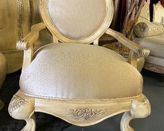 Ornate solid wood ivory finish  Princess armed chair. Clawed feet. Over stuffed seat with oval wood frame back.