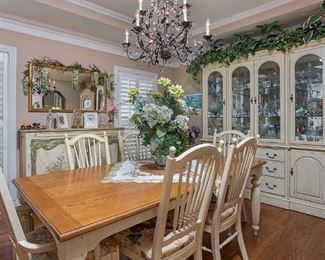 Beautiful Bernhardt dining room set. Pickled Ivory solid wood with solid maple. China cabinet BASE; 70”long x 34” high x18 “ deep with four drawers and two side cabinets with two shelves. TOP: Luminated with mirrored back, four glass doors . Three shelves, two are thick glass. Brushed bronze hardware. 70” length x51” high x16 “ deep.     TABLE; 38” x64 “ long x38 “add one leaf extends to 82 “ long, add two leaves extends to 100 “ long . Includes four side chairs and two armed chairs . Beautiful, versatile set. Like NEW!