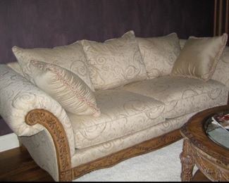 Beautiful ivory sofa .94”Long x 40”  deep x 20 “ seat height x 32 “ overall back height. Two large seat cushions with Three back cushions. Solid wood scrolled frame.