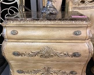 Ivory scrolled solid wood oversized nightstand with removable marble top. Three drawers. DIMENSIONS: 35” wide x20 “deep x 31” high.