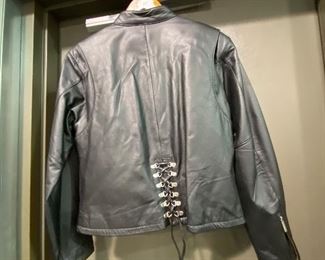 Harley Davidson leather lace up back Ladies Jacket size small  zippered cuffs gusset red arms.  More Harley clothing offered.  NEW , never worn