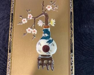 Oriental art wall hanging.oriental frame with special wall hook gold background with ivory look art. 13 1/2 x 8 1/2. other similar pieces available.