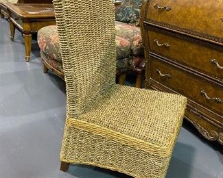 Wicker low rise conversation/ desk chair with solid wood top trim .