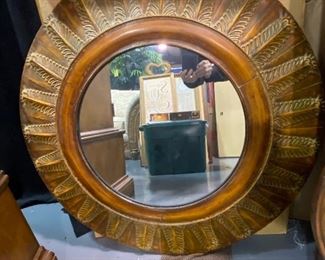 Round metal mirror 34”. Bronze finish with leaf design. Mirrored are is 17 1/2 “ round.   More mirrors available