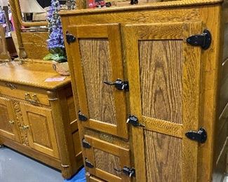 Original BLUEGRASS oak icebox. Excellent condition with latch hook handles one long cabinet with two short cabinets and ice compartment. 46 1/2 “x 31 1/2 “ x 18”